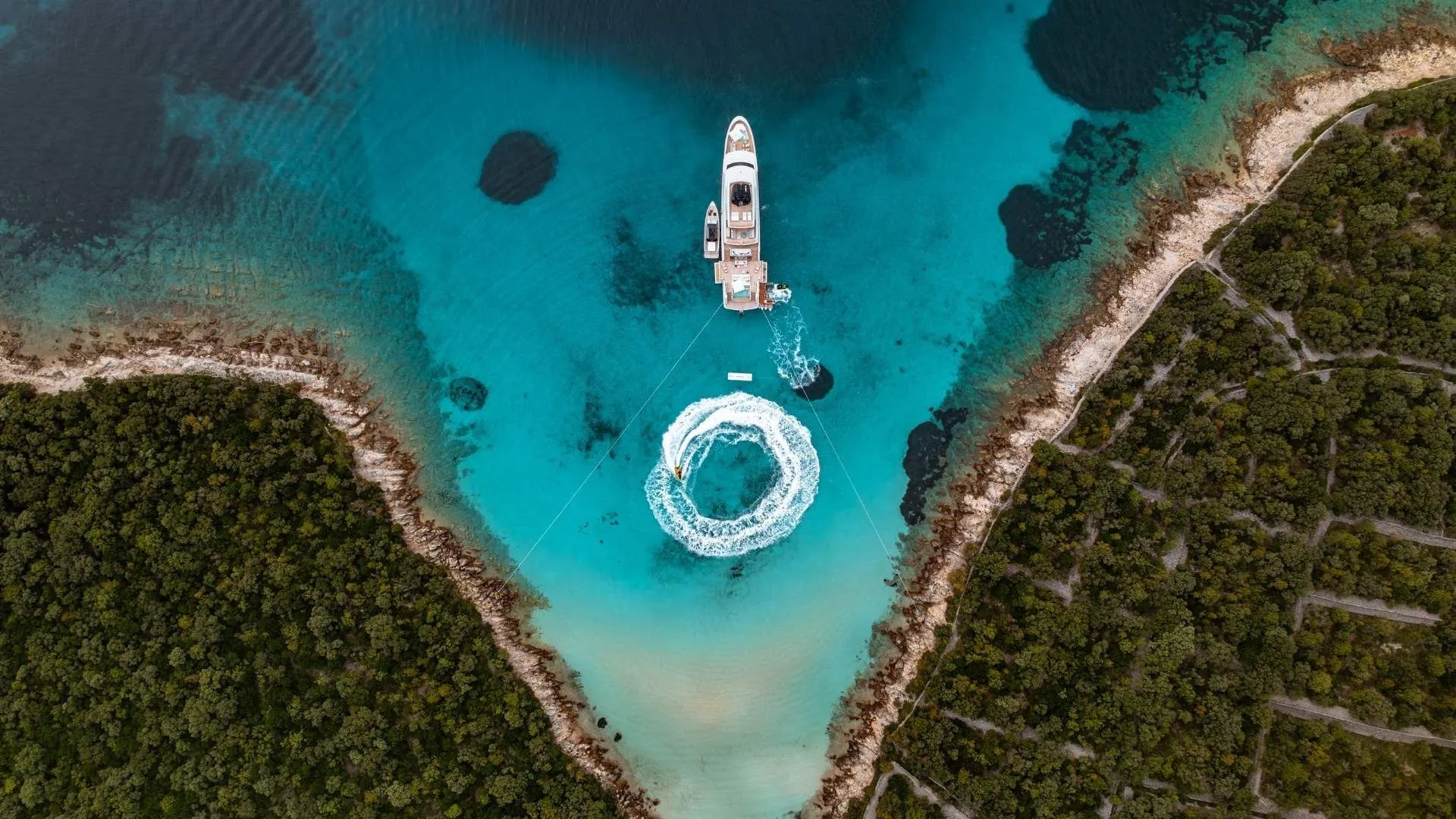 Yacht anchored in a turquoise Croatian cove